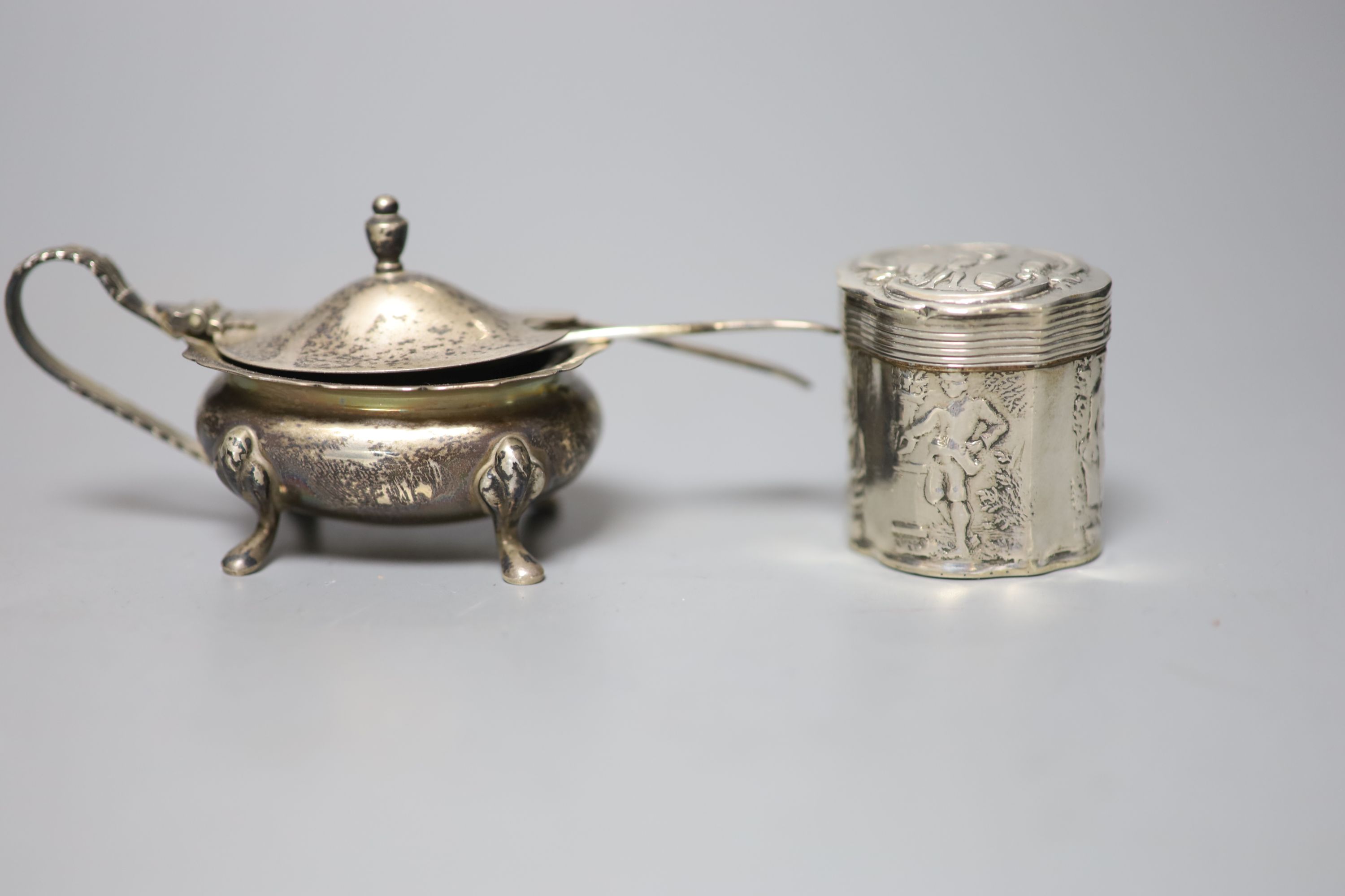 A silver three piece condiment set, a Dutch white metal pill box and a pair of plated candle snuffers.